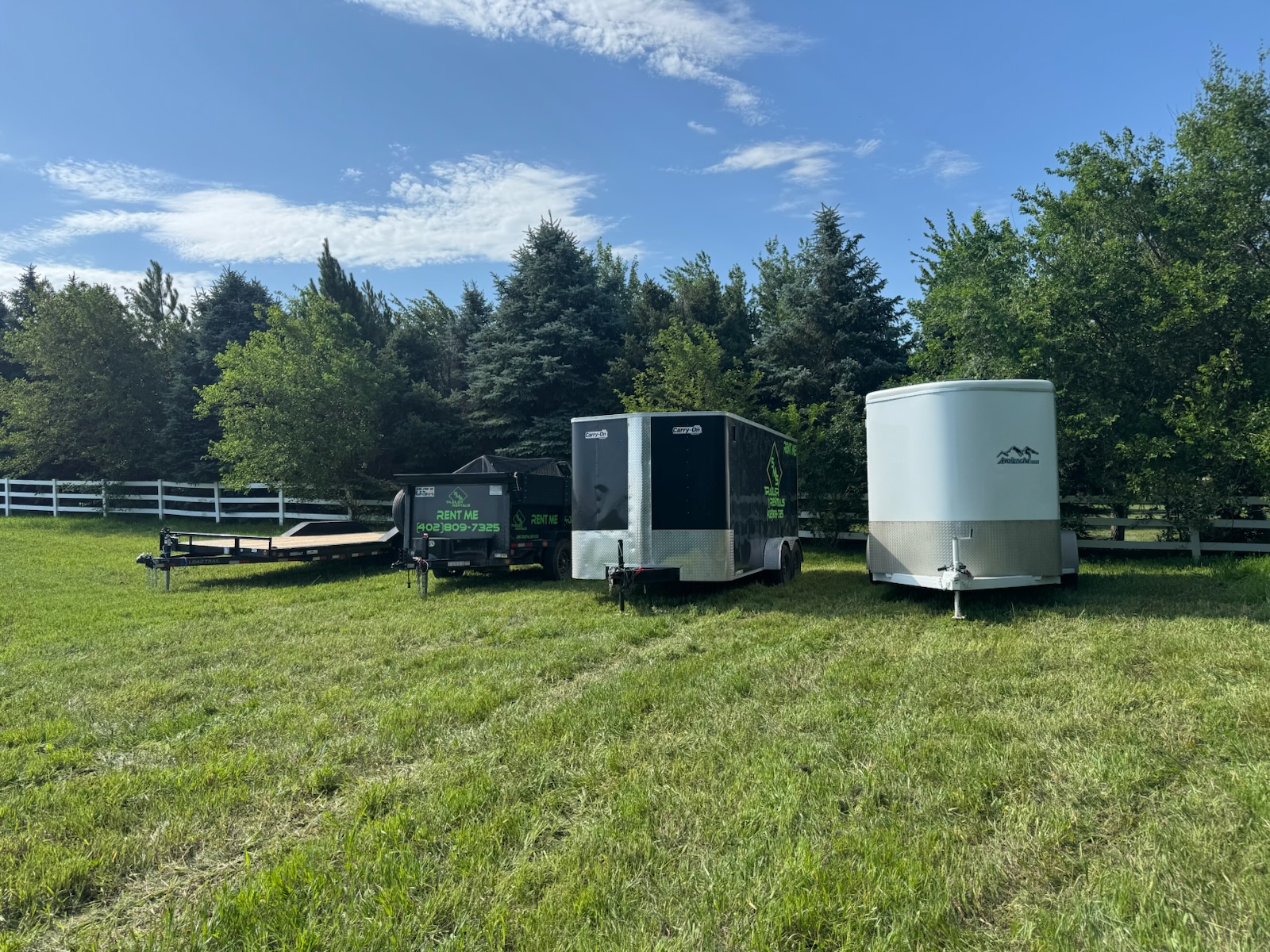 SMS Trailer Rentals fleet lineup — dump, enclosed and car-hauler trailers in Lincoln, NE